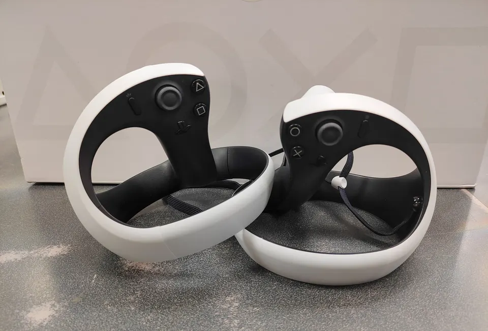 Sony PlayStation VR2 headset with two Sense controllers and inner box
