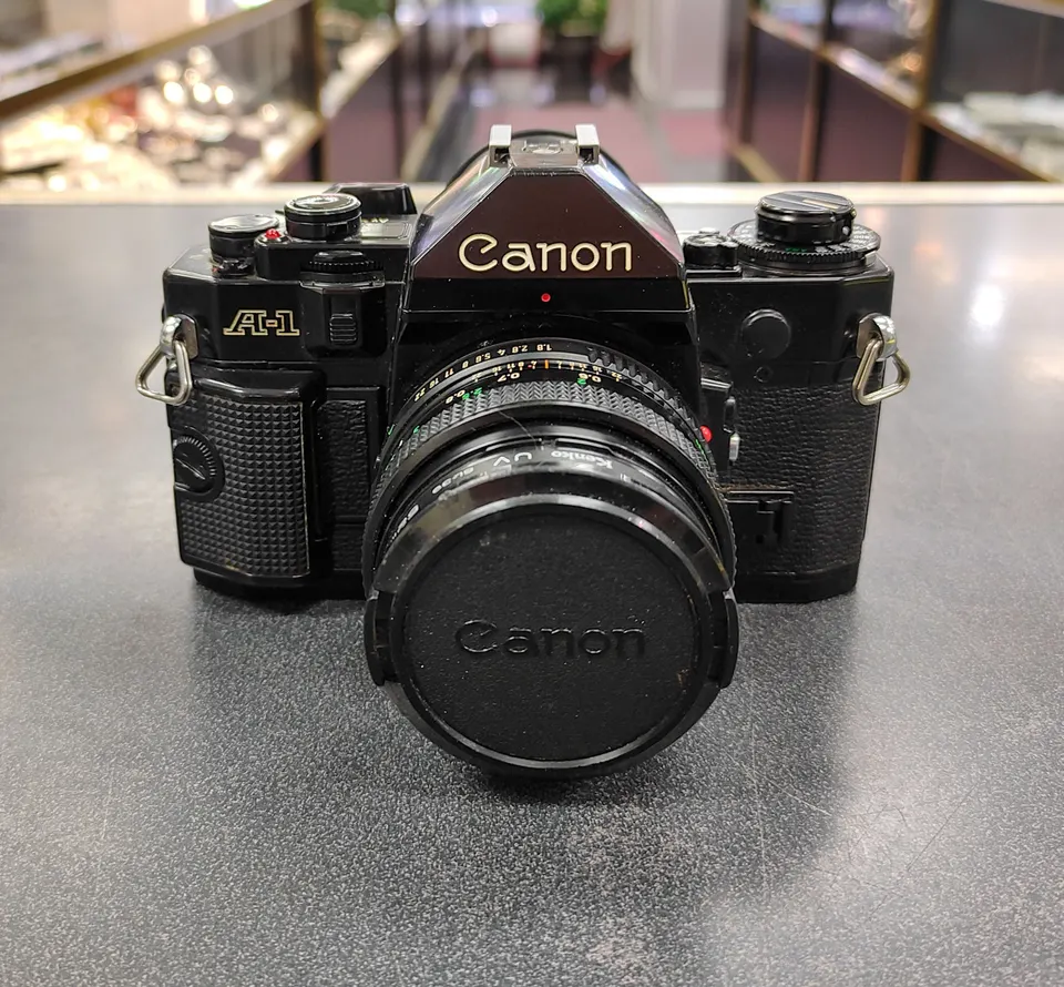 Canon A-1 35mm film camera with Canon FD 50mm f/1.8 lens in great cosmetic condition