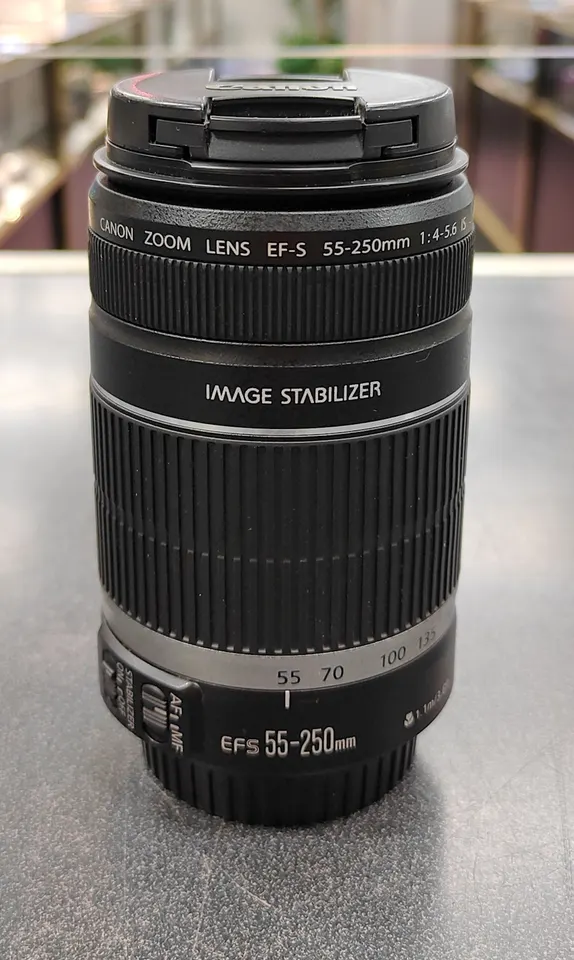Canon EF-S 55-250mm f/4-5.6 IS telephoto zoom lens in black with front and rear caps, great condition