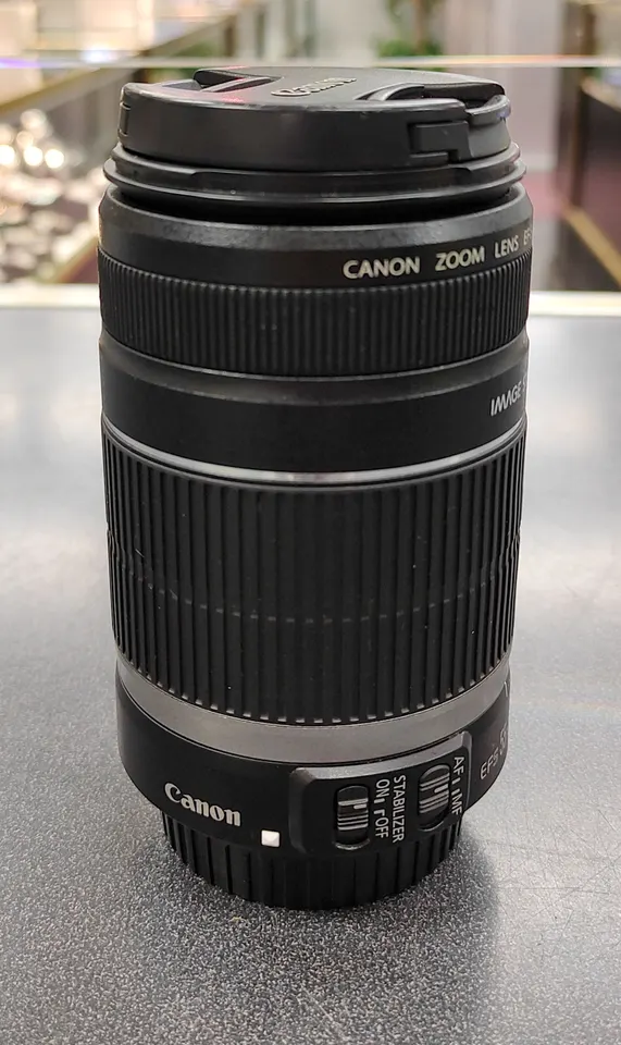 Canon EF-S 55-250mm f/4-5.6 IS telephoto zoom lens in black with front and rear caps, great condition