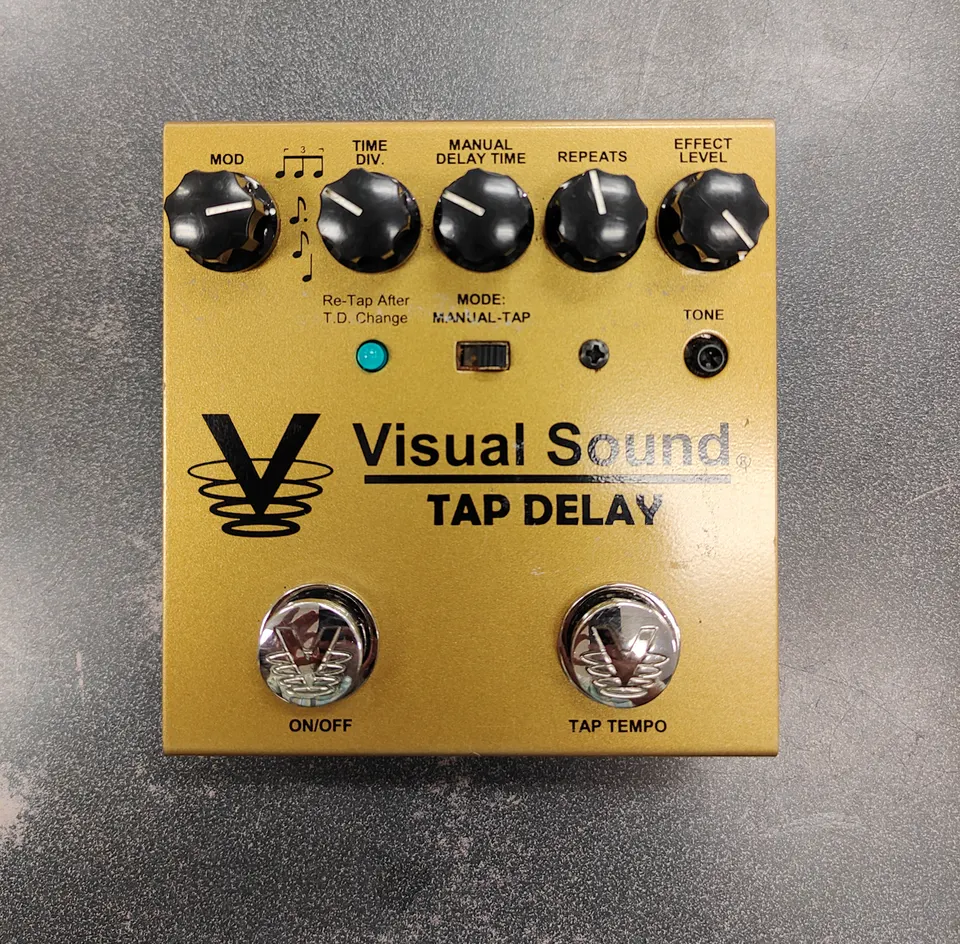 Visual Sound V3 Tap Delay pedal in gold finish with light used wear and bottom Velcro pad