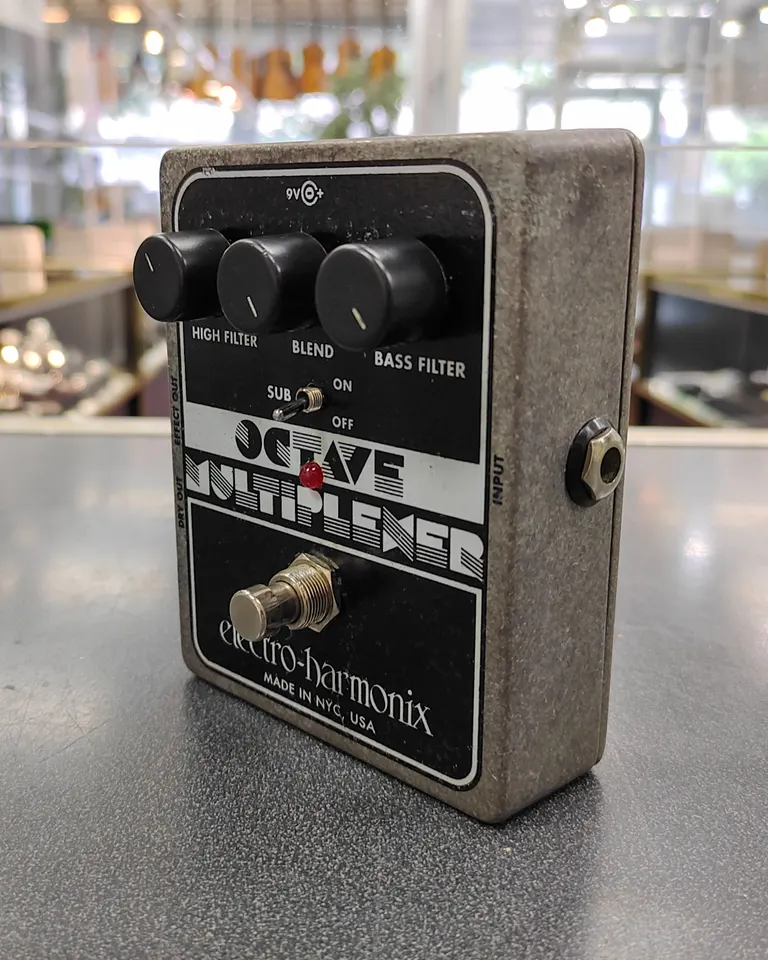 Electro-Harmonix Octave Multiplexer big-box analog sub-octave pedal with visible used wear and bottom Velcro pad