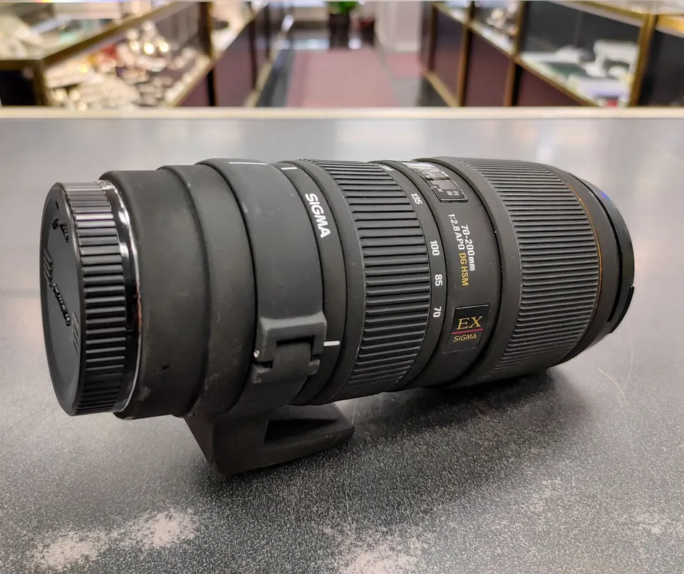 Sigma 70–200mm f/2.8 Canon EF telephoto lens with tripod collar and front and rear caps