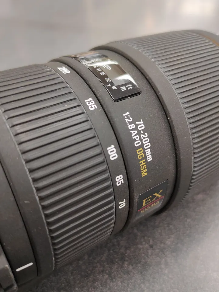 Sigma 70–200mm f/2.8 Canon EF telephoto lens with tripod collar and front and rear caps