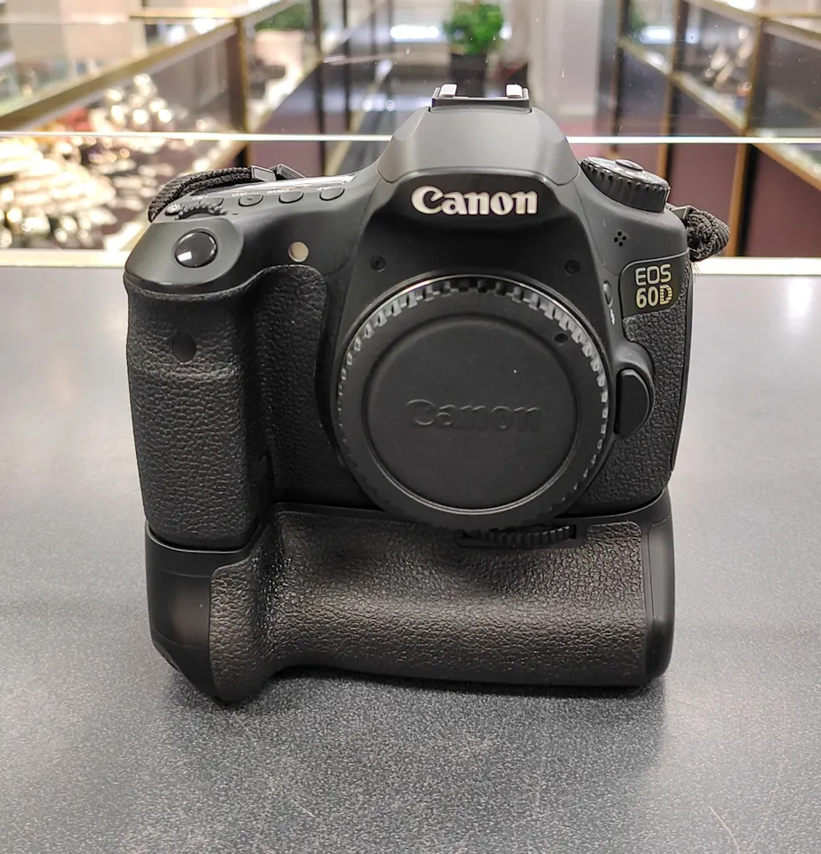 Canon EOS 60D DSLR camera body with genuine Canon BG-E9 battery grip, body cap, strap, battery, travel charger, 16GB SD card