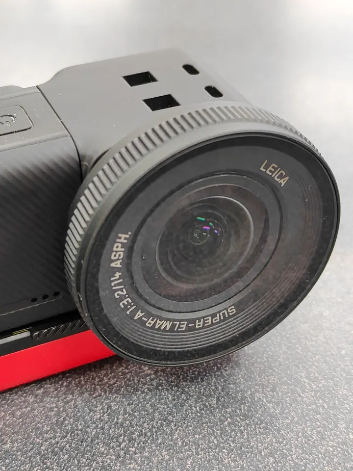 Insta360 ONE RS action camera with Leica 1-Inch Wide Angle Lens, red battery base, mounting bracket, microphone adapter