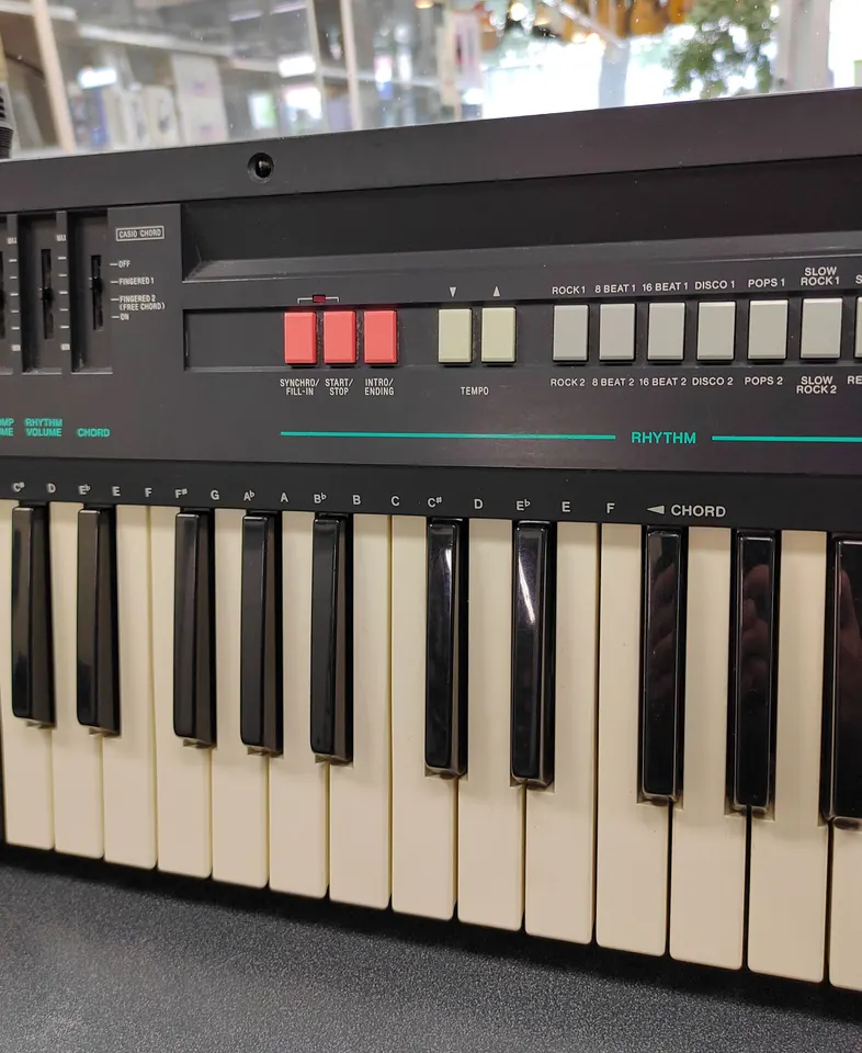 Vintage Casio Casiotone CT-370 electronic keyboard with 49 keys, 210 Sound Tone Bank, built-in speaker, rhythm controls