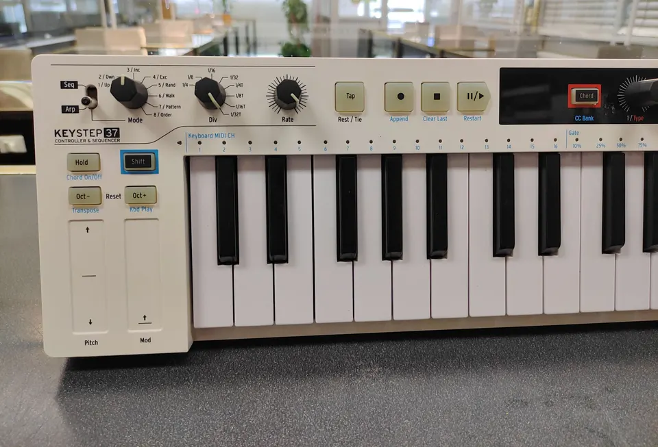 White Arturia KeyStep 37 MIDI keyboard controller and sequencer with 37 keys and DC power adapter