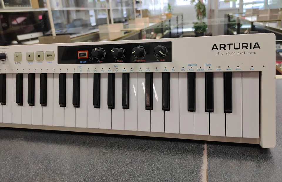 White Arturia KeyStep 37 MIDI keyboard controller and sequencer with 37 keys and DC power adapter