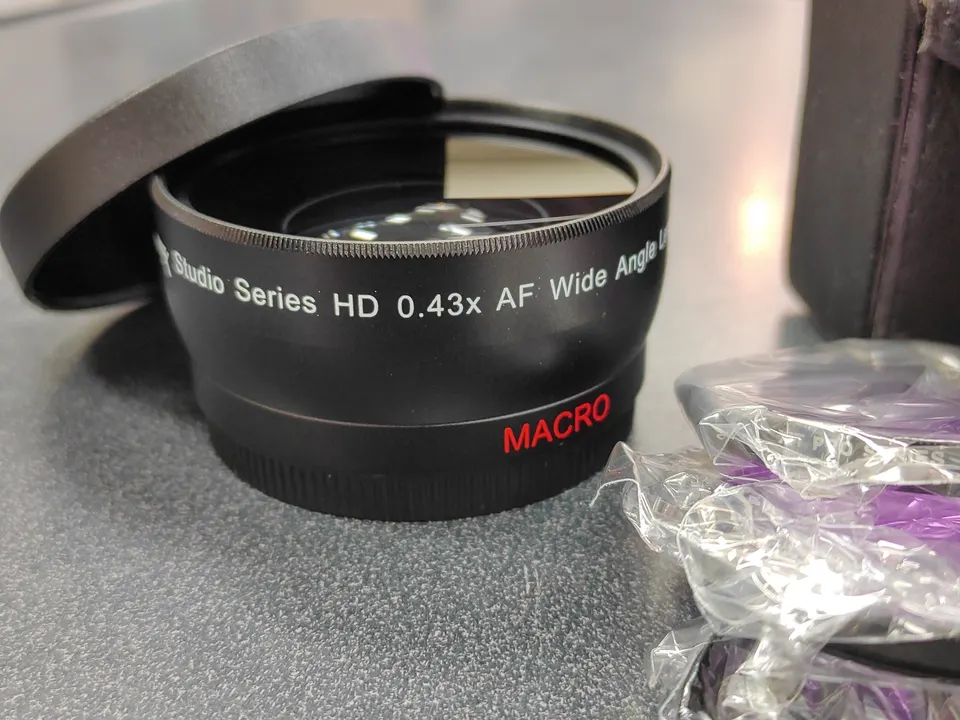 Ultimaxx / XIT 55mm camera accessory bundle with wide-angle, telephoto, filters, caps, and pouches