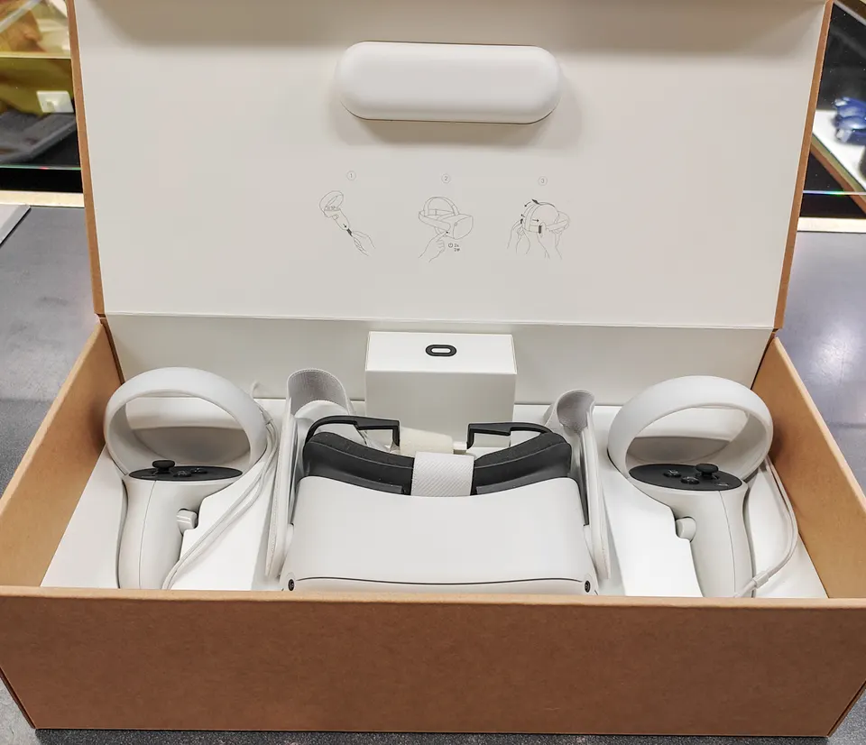 Oculus Quest 2 64GB VR headset complete set shown with original box, Touch controllers, charger, cable, glasses spacer, acces