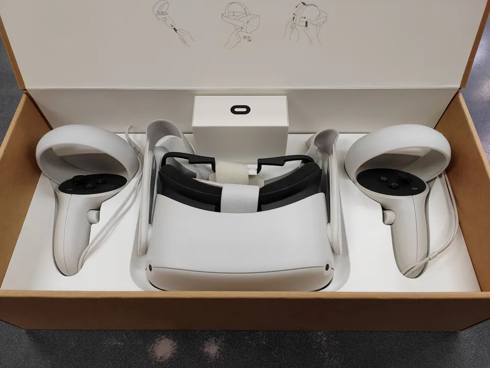 Oculus Quest 2 64GB VR headset complete set shown with original box, Touch controllers, charger, cable, glasses spacer, acces