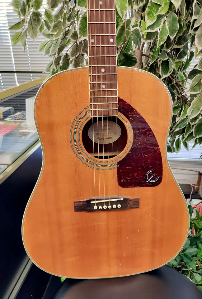 Epiphone AJ-220S NA acoustic guitar in natural finish with tortoise-style pickguard, chrome tuners, light cosmetic wear