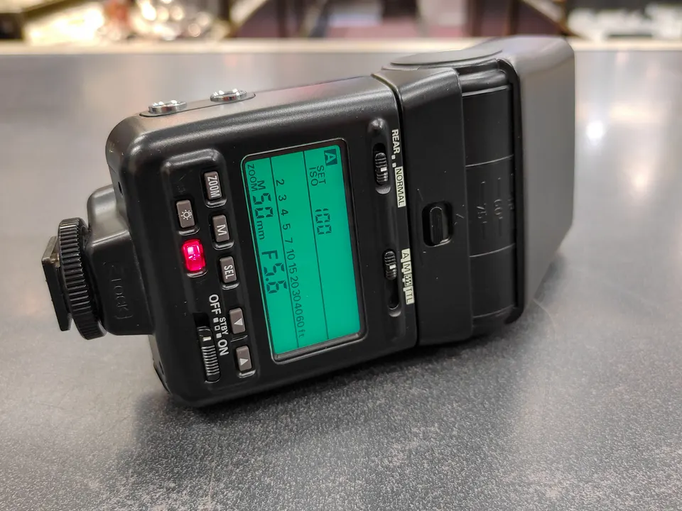 Nikon Speedlight SB-24 flash unit shown from multiple angles with LCD display