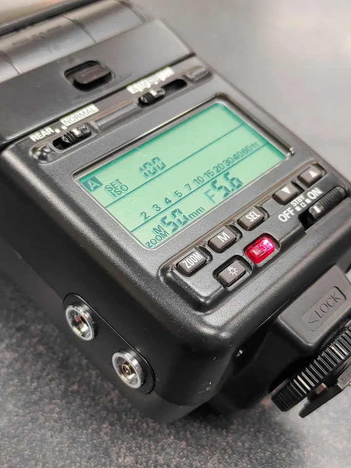 Nikon Speedlight SB-24 flash unit shown from multiple angles with LCD display
