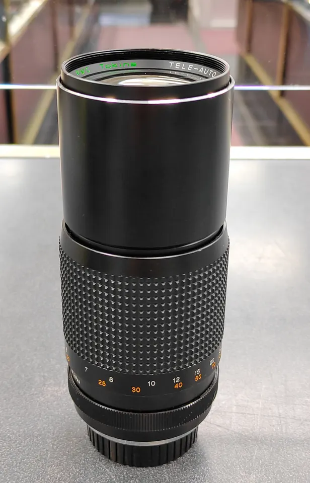 RMC Tokina Tele-Auto 300mm f/5.6 Minolta MD-mount lens shown from front and rear