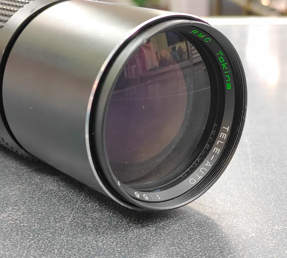 RMC Tokina Tele-Auto 300mm f/5.6 Minolta MD-mount lens shown from front and rear