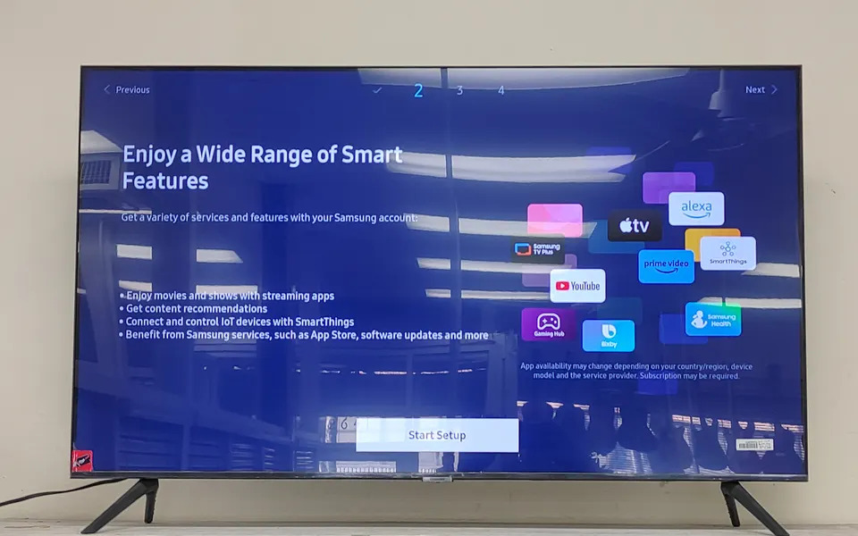 Samsung Crystal UHD CU7000 50” 4K Smart TV (UN50CU7000F) shown with original remote and original retail box; open-box, unused