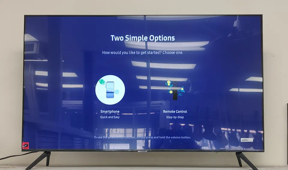Samsung Crystal UHD CU7000 50” 4K Smart TV (UN50CU7000F) shown with original remote and original retail box; open-box, unused