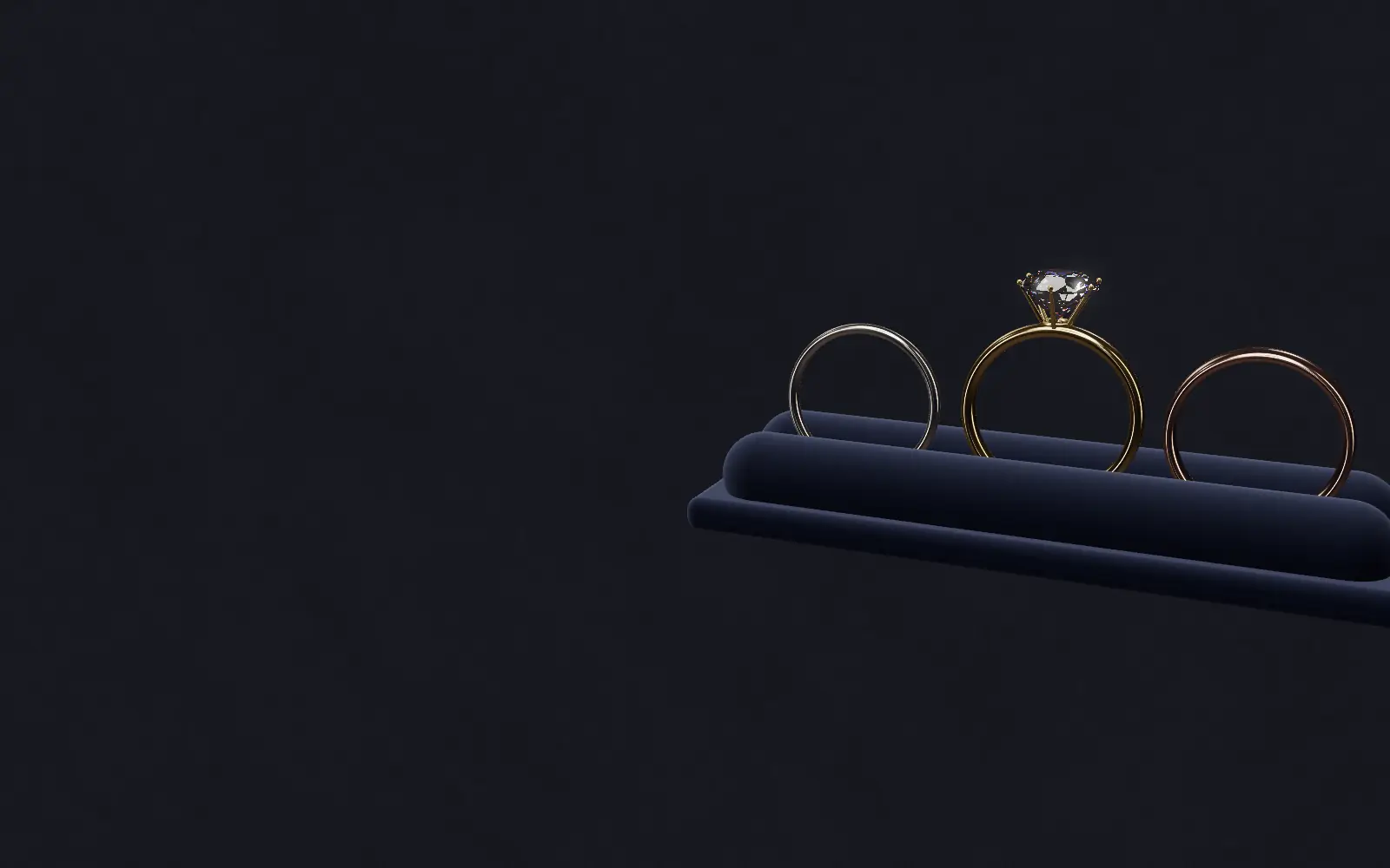 Illustration of three gold rings on a velvet ring tray